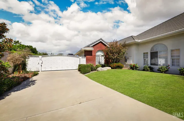 an aerial view of residential houses with outdoor space and swimming pool