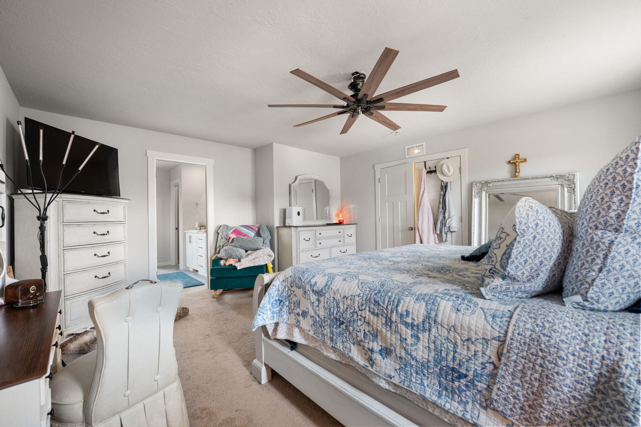 4039 Southwest Quartz Place Redmond, OR 97756 - Photo 34 of 44 a bedroom with a bed and a flat tv screen