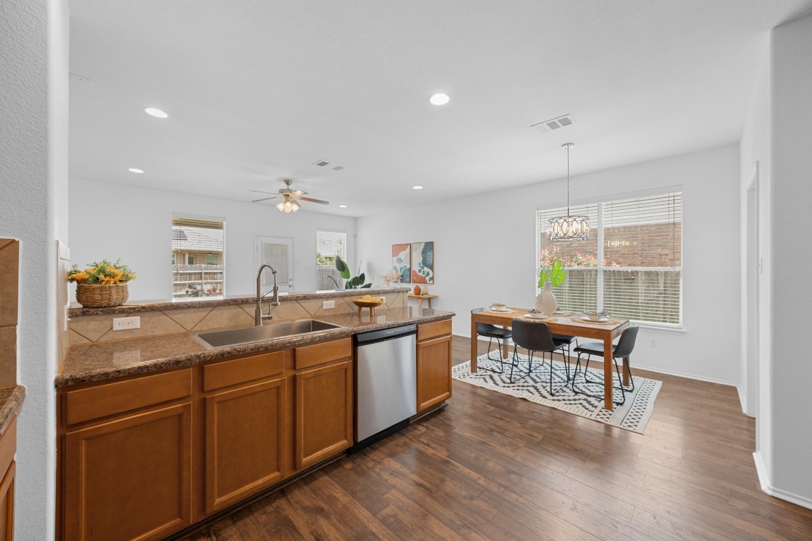 3612 Raven Caw Pass Pflugerville, TX 78660 - Photo 16 of 40 a kitchen with a sink and cabinets
