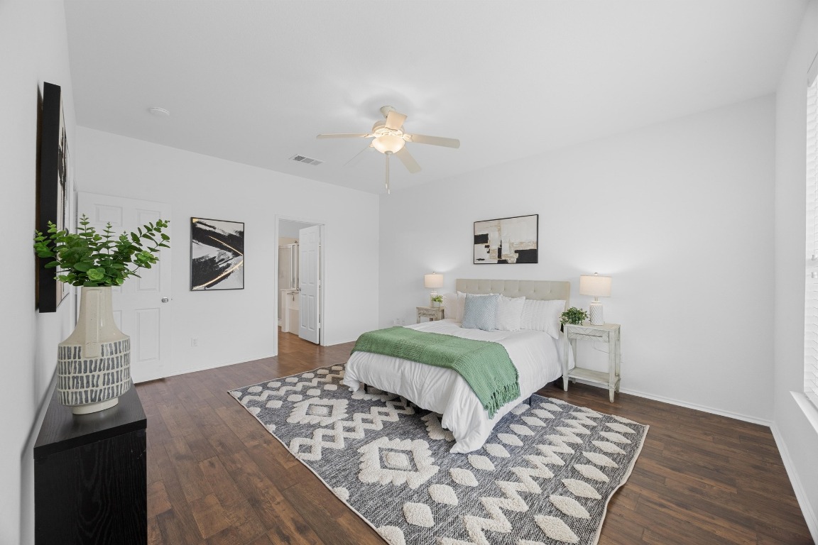 3612 Raven Caw Pass Pflugerville, TX 78660 - Photo 20 of 40 a bedroom with furniture and a bed