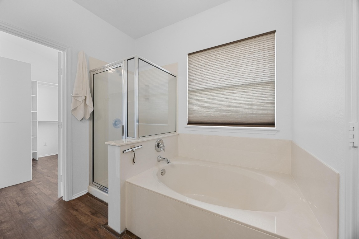 3612 Raven Caw Pass Pflugerville, TX 78660 - Photo 23 of 40 a white bath tub sitting next to a shower