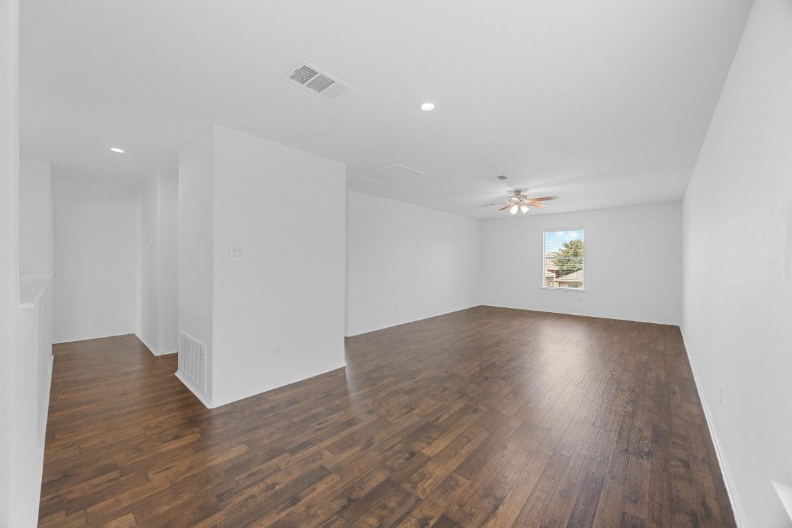3612 Raven Caw Pass Pflugerville, TX 78660 - Photo 25 of 40 an empty room with wooden floor and windows