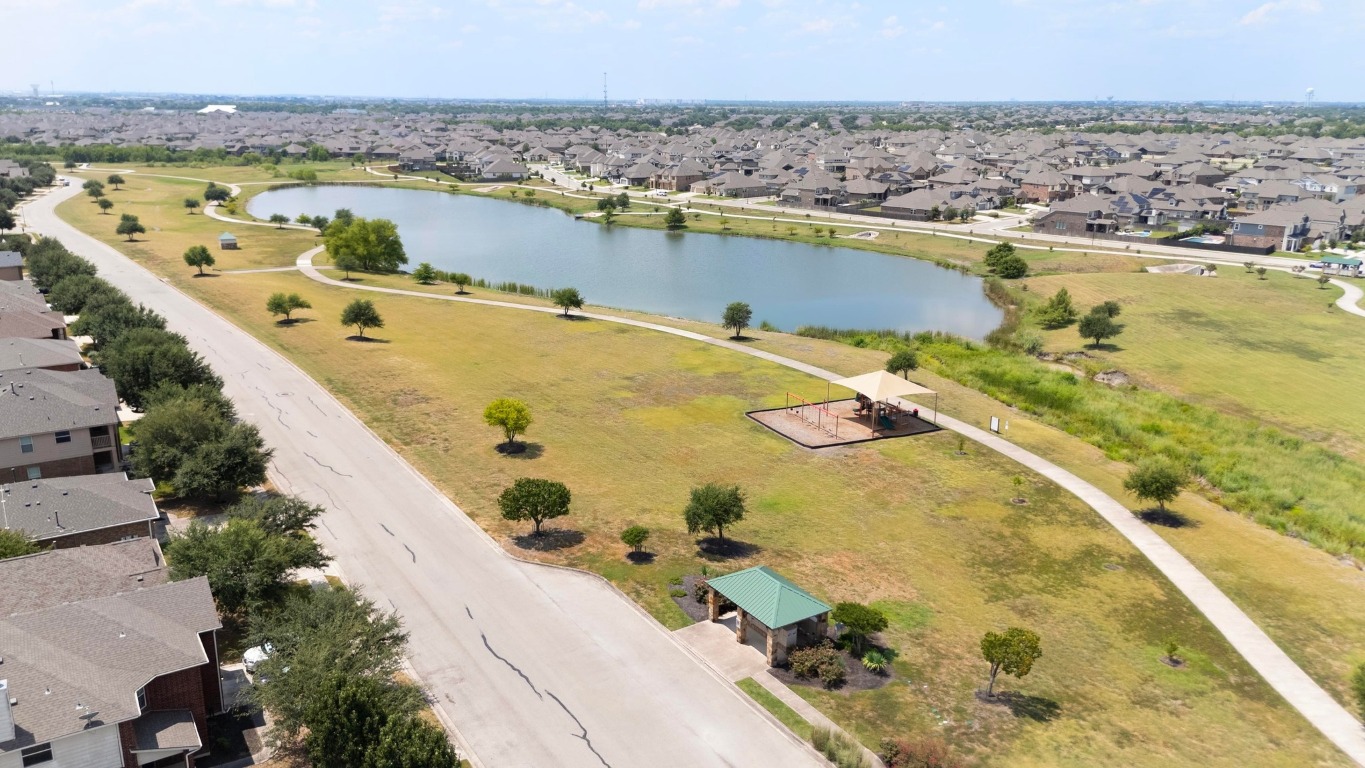 3612 Raven Caw Pass Pflugerville, TX 78660 - Photo 39 of 40 a view of a swimming pool with an ocean view