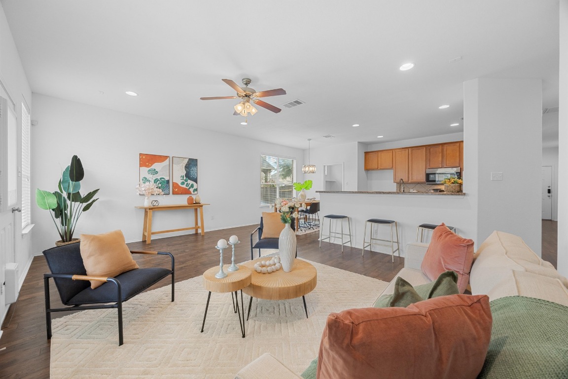 3612 Raven Caw Pass Pflugerville, TX 78660 - Photo 8 of 40 a living room with furniture kitchen and a potted plant