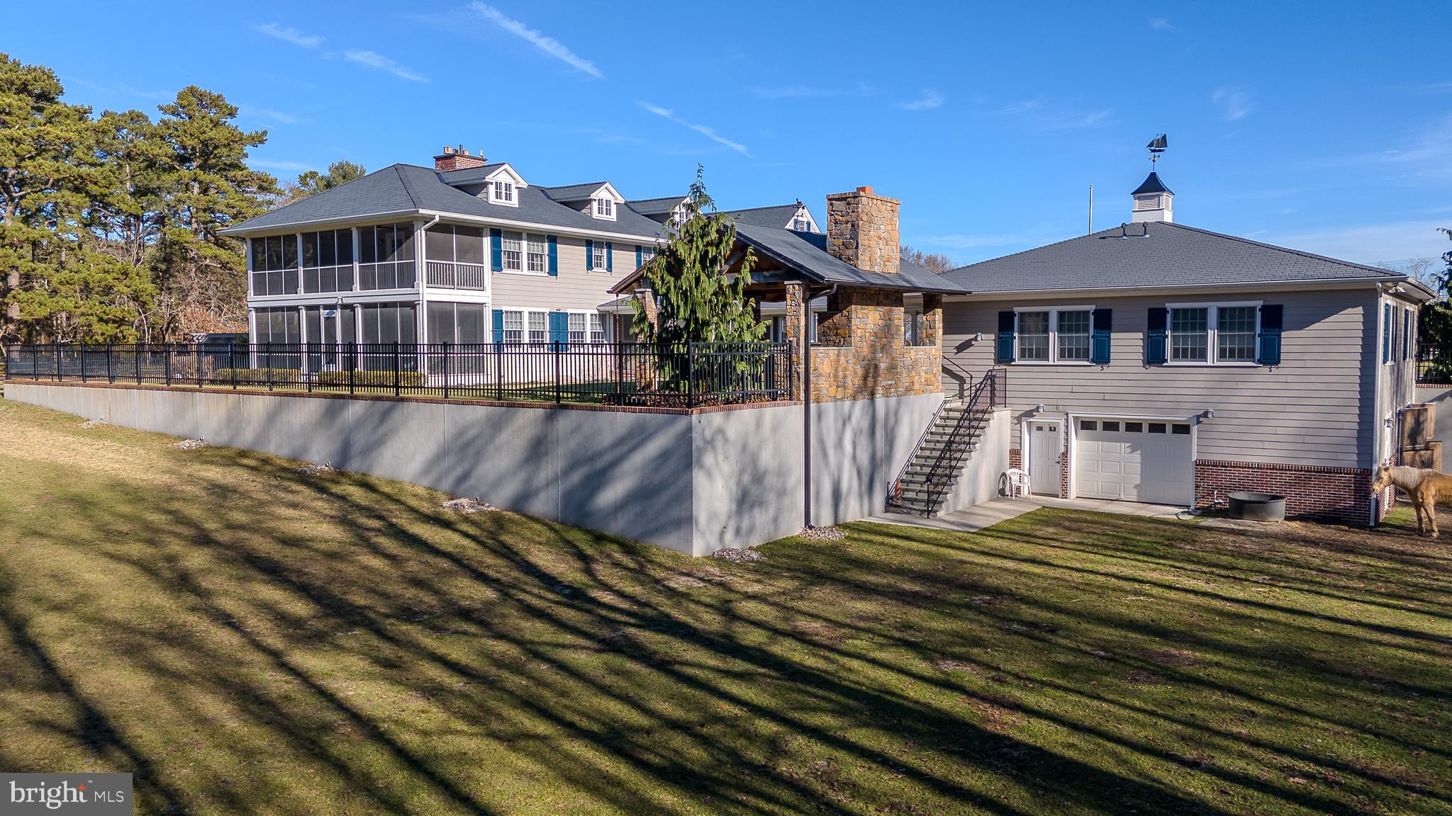 2029 East Buckshutem Road Port Norris, NJ 08349 - Photo 21 of 32 a front view of a house with a yard