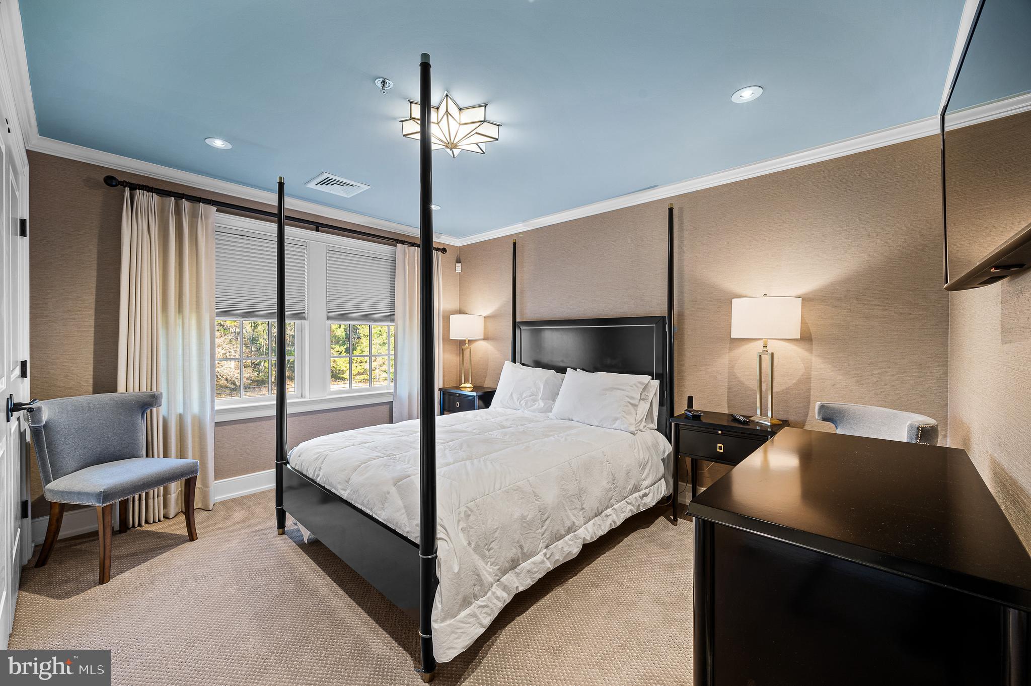 2029 East Buckshutem Road Port Norris, NJ 08349 - Photo 10 of 32 a bedroom with a bed and a chandelier