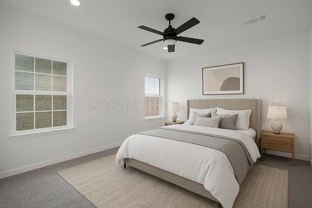 a bedroom with a large bed and a window