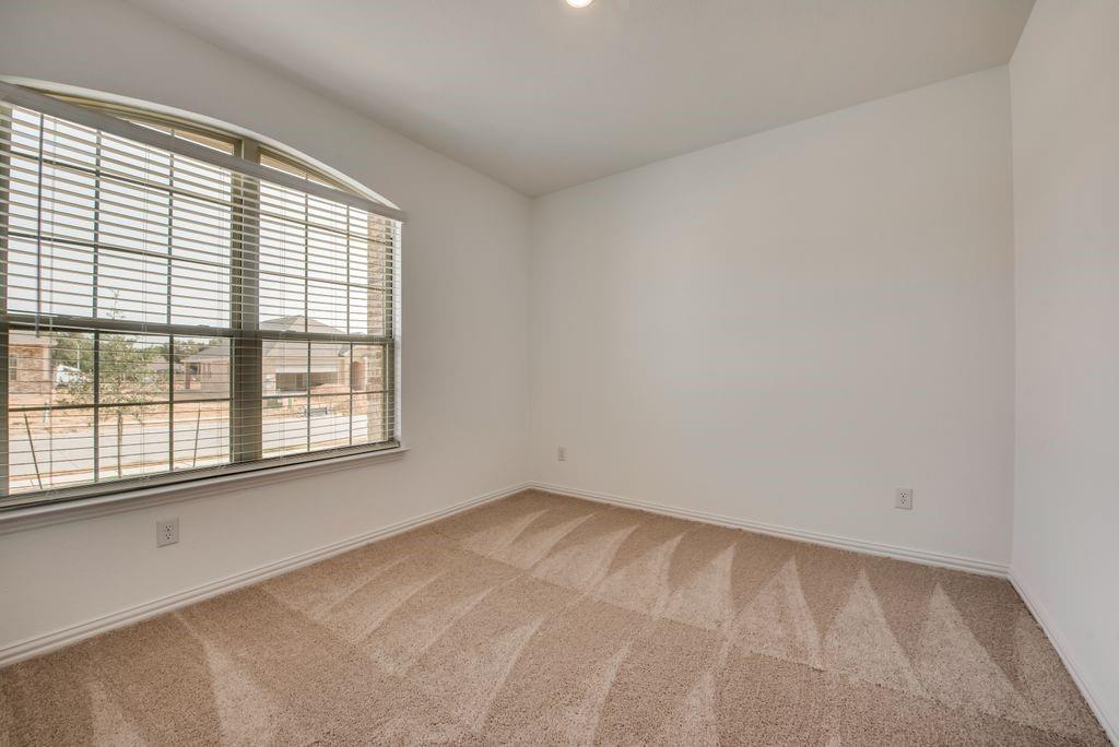 204 Coconut Drive Azle, TX 76020 - Photo 10 of 20 an empty room with a window