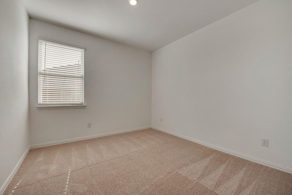 204 Coconut Drive Azle, TX 76020 - Photo 12 of 20 an empty room with a window