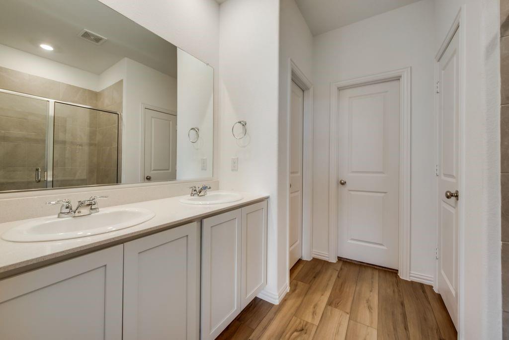 204 Coconut Drive Azle, TX 76020 - Photo 17 of 20 a bathroom with a sink and a mirror