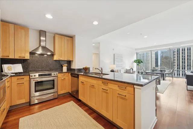 a kitchen with sink stove and cabinets