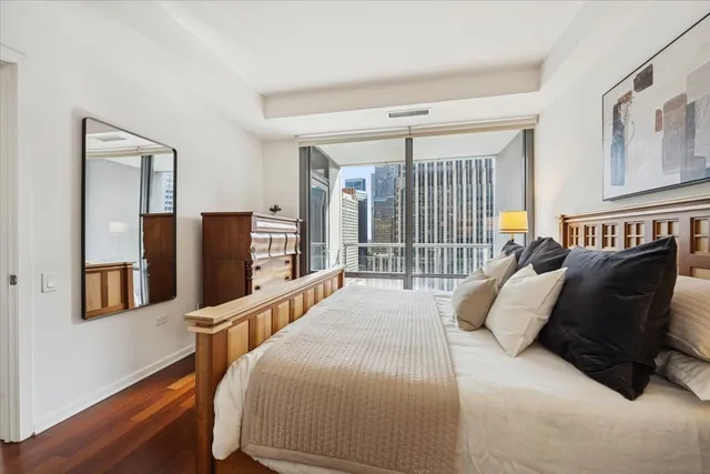 a bed with a black and white comforter