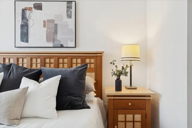 a bathroom with a granite countertop sink a toilet and a mirror