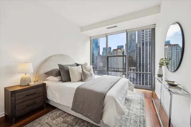 a reading room with furniture and a book shelf