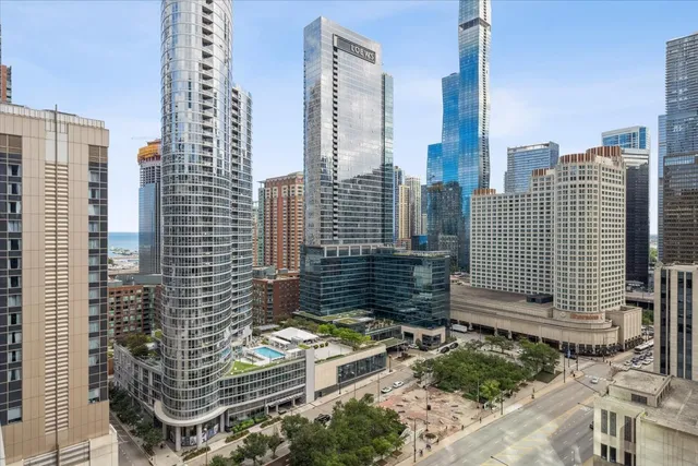 a swimming pool with outdoor seating and yard