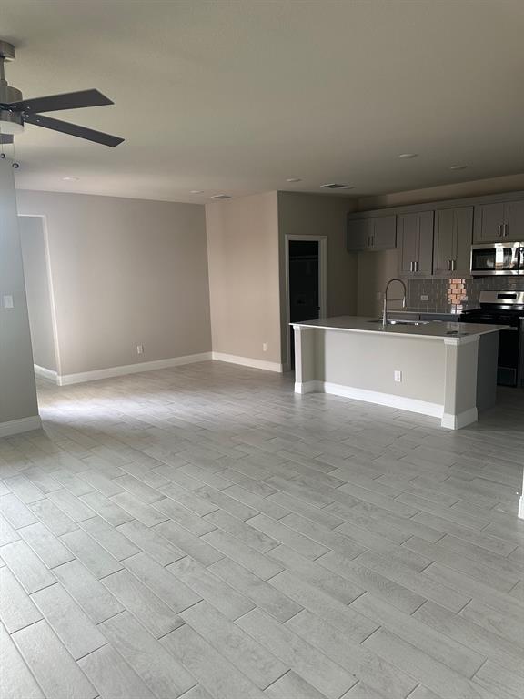 3104 Camilli Cove Princeton, TX 75407 - Photo 4 of 15 a view of a kitchen with a sink and cabinets