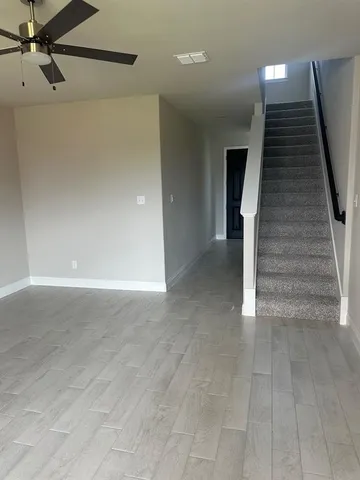 a view of a hallway with stairs
