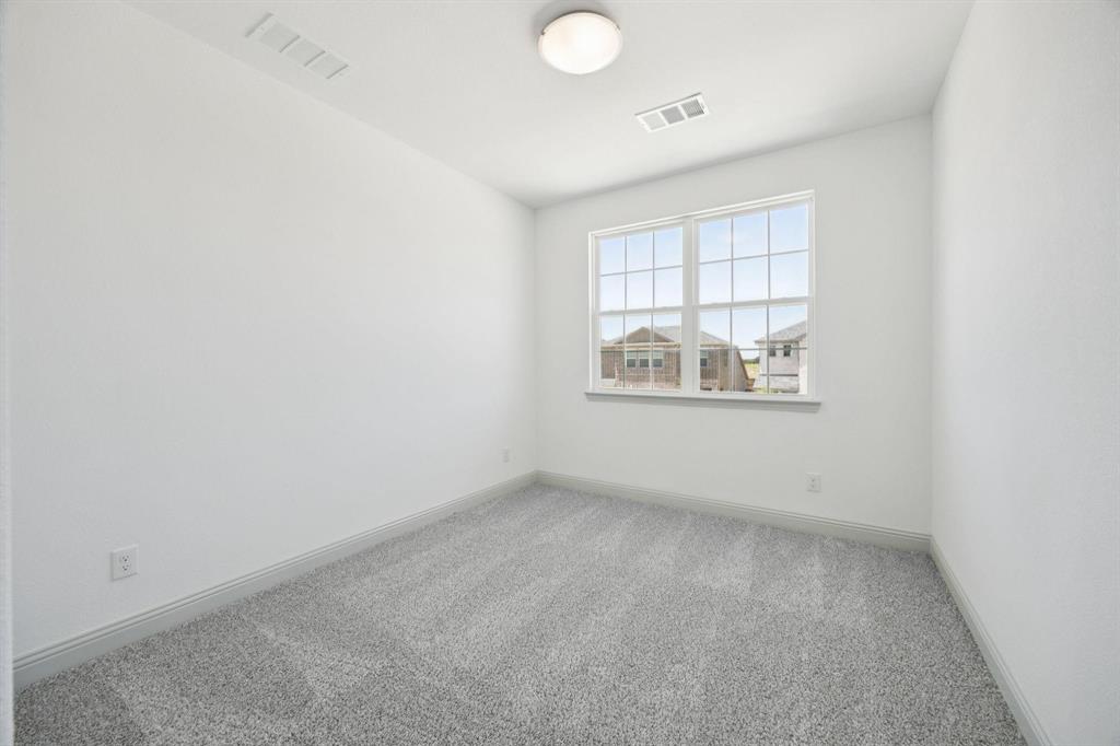 3104 Camilli Cove Princeton, TX 75407 - Photo 7 of 15 an empty room with windows