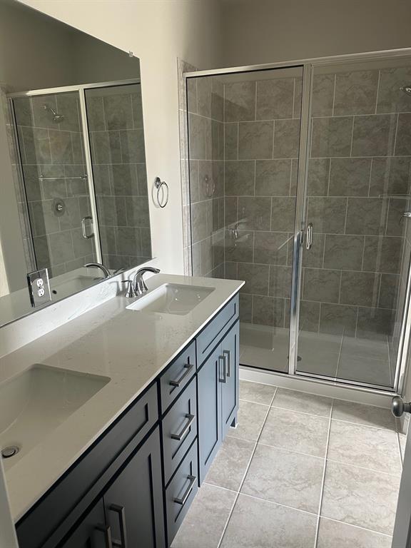 3104 Camilli Cove Princeton, TX 75407 - Photo 9 of 15 a bathroom with a sink and a mirror