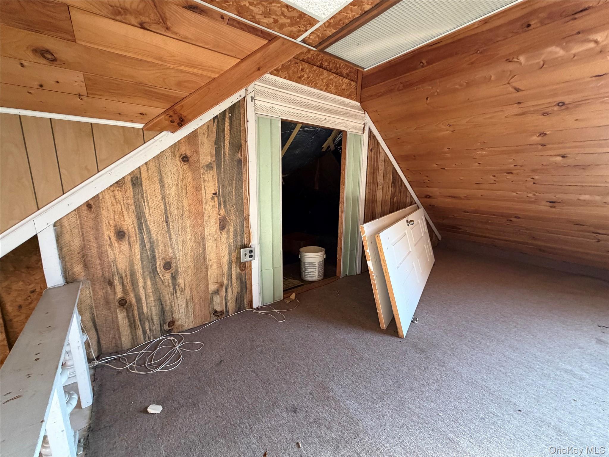 40-36 69th Street Queens, NY 11377 - Photo 32 of 32 a view of a livingroom with stairs and furniture