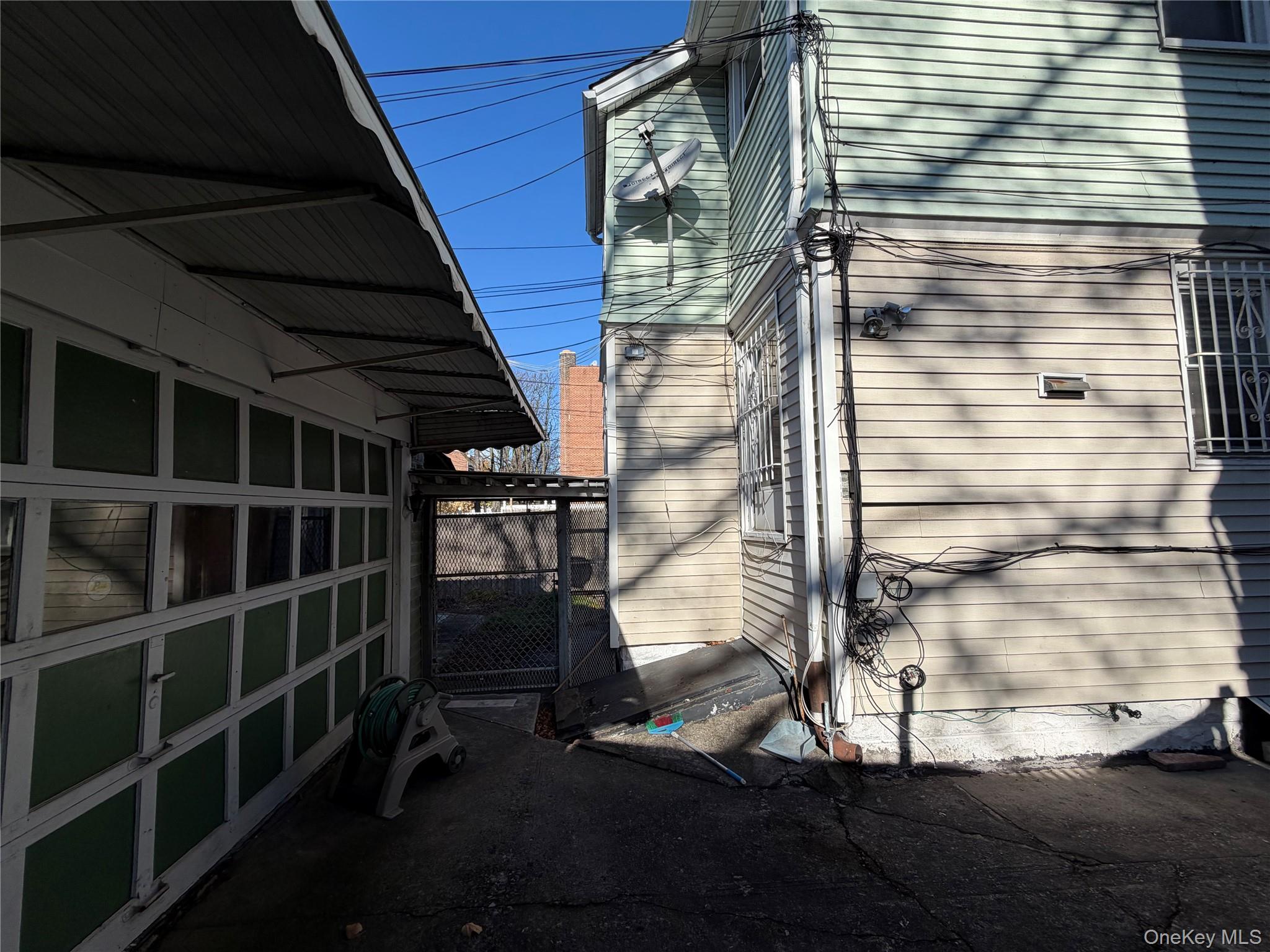 40-36 69th Street Queens, NY 11377 - Photo 8 of 32 Garage and back view of the house
