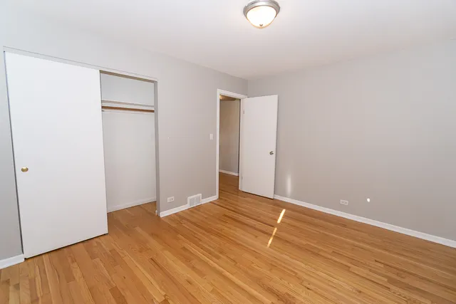 a view of room with wooden floor