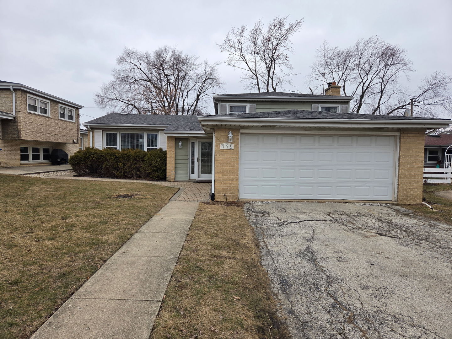 756 West Millers Road Des Plaines, IL 60016 - Photo 2 of 27 a front view of a house with a yard and garage