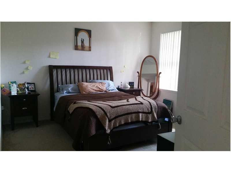 6942 West Sample Road, Unit 6942 Pompano Beach, FL 33063 - Photo 16 of 30 Master Bedroom