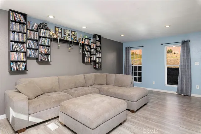 a living room with furniture and walk in closet