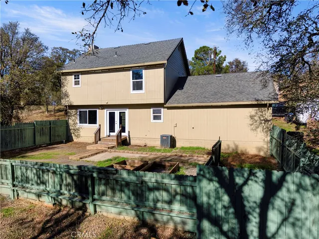 a aerial view of a house with swimming pool