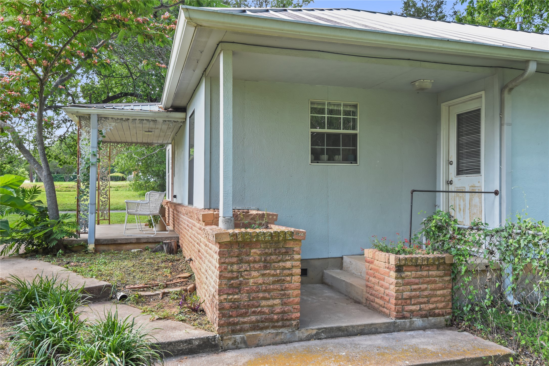 528 Old McDade Road Elgin, TX 78621 - Photo 31 of 40 Side of home and separate entrance to primary bedroom