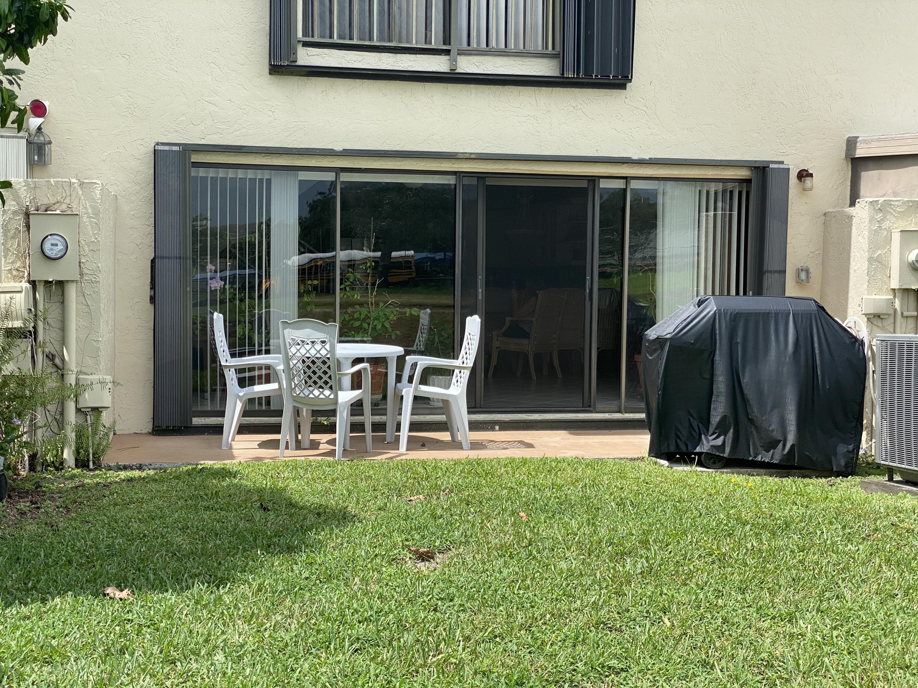 8904 G Southwest 22nd Street Boca Raton, FL 33433 - Photo 37 of 40 Back w table