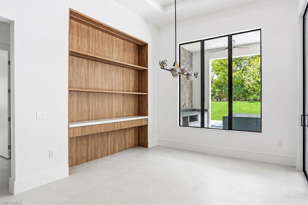14318 Charthouse Circle Naples, FL 34114 - Photo 7 of 36 a view of an empty room with a window