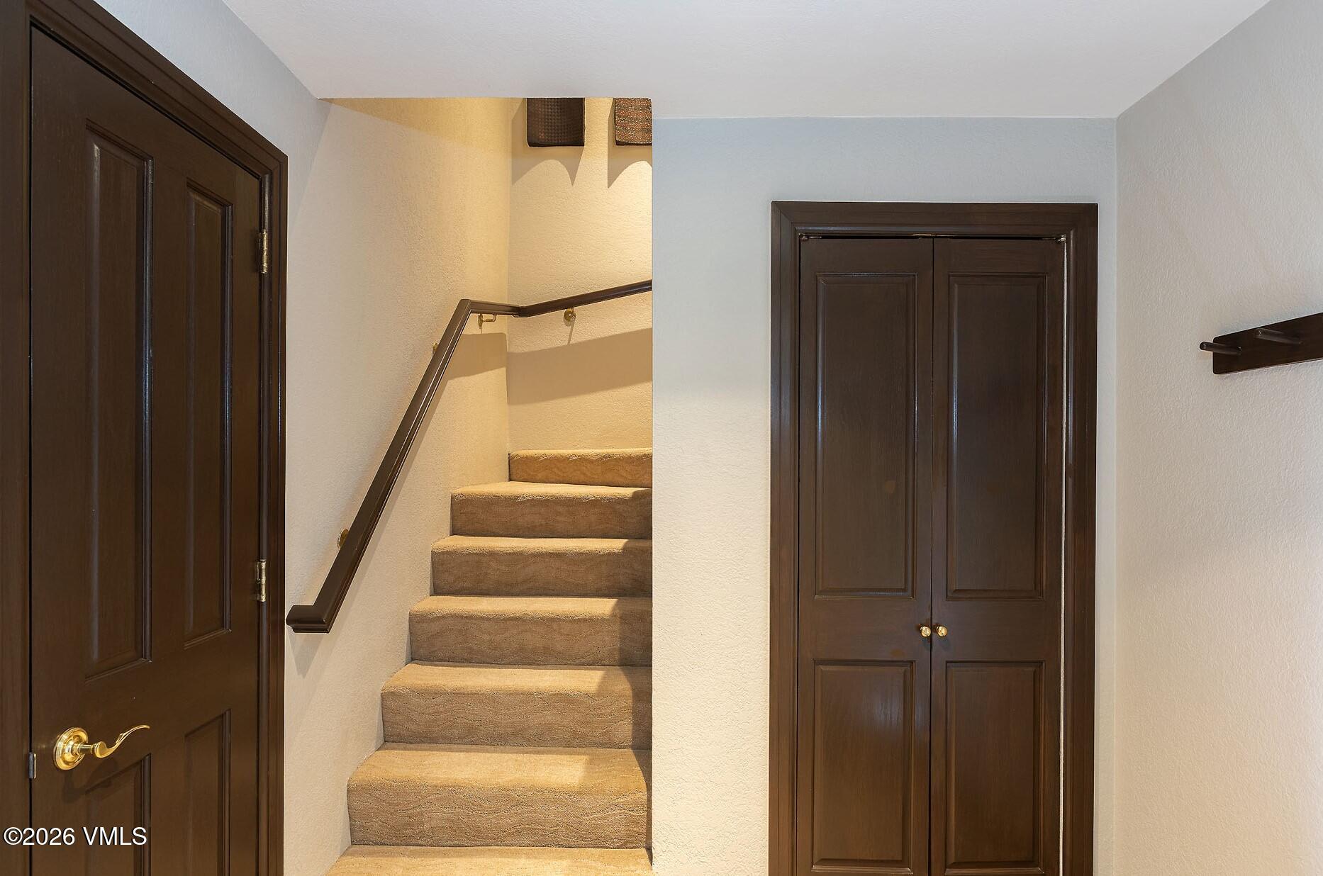 210 Offerson Road, Unit 41428 Beaver Creek, CO 81620 - Photo 14 of 25 a view of staircase with wooden floor and door