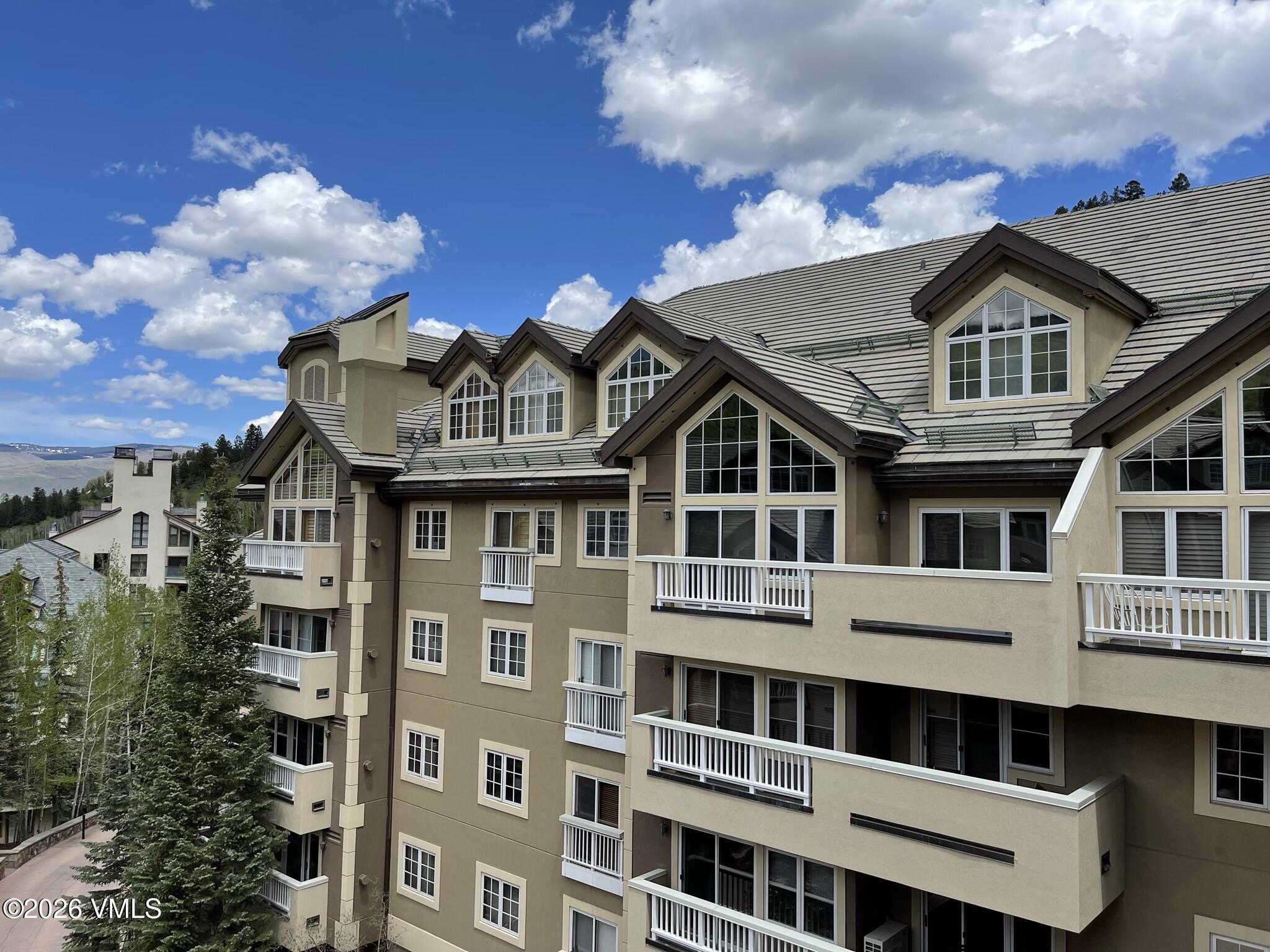 210 Offerson Road, Unit 41428 Beaver Creek, CO 81620 - Photo 17 of 25 a front view of a house with a yard