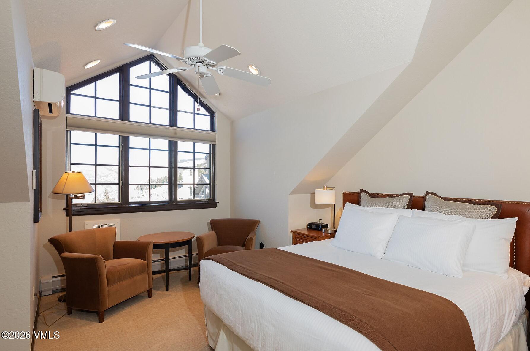 210 Offerson Road, Unit 41428 Beaver Creek, CO 81620 - Photo 7 of 25 a bedroom with furniture and a large window