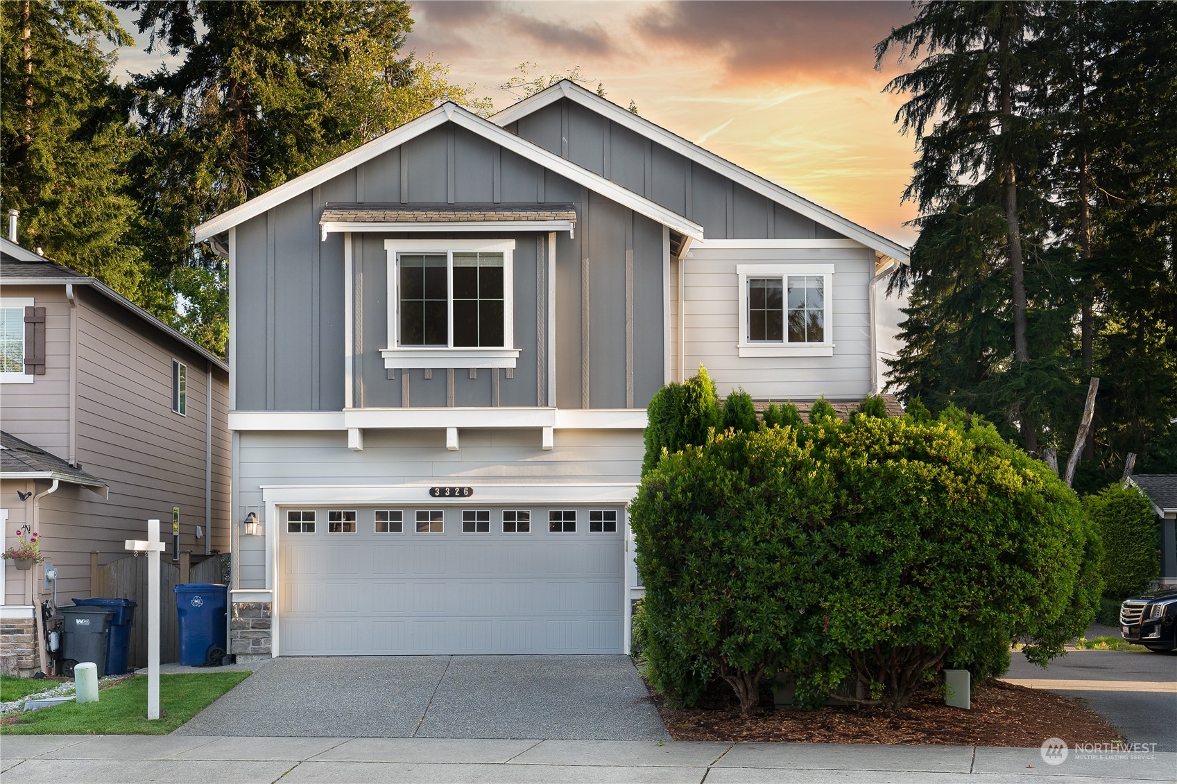 a front view of a house with a garage
