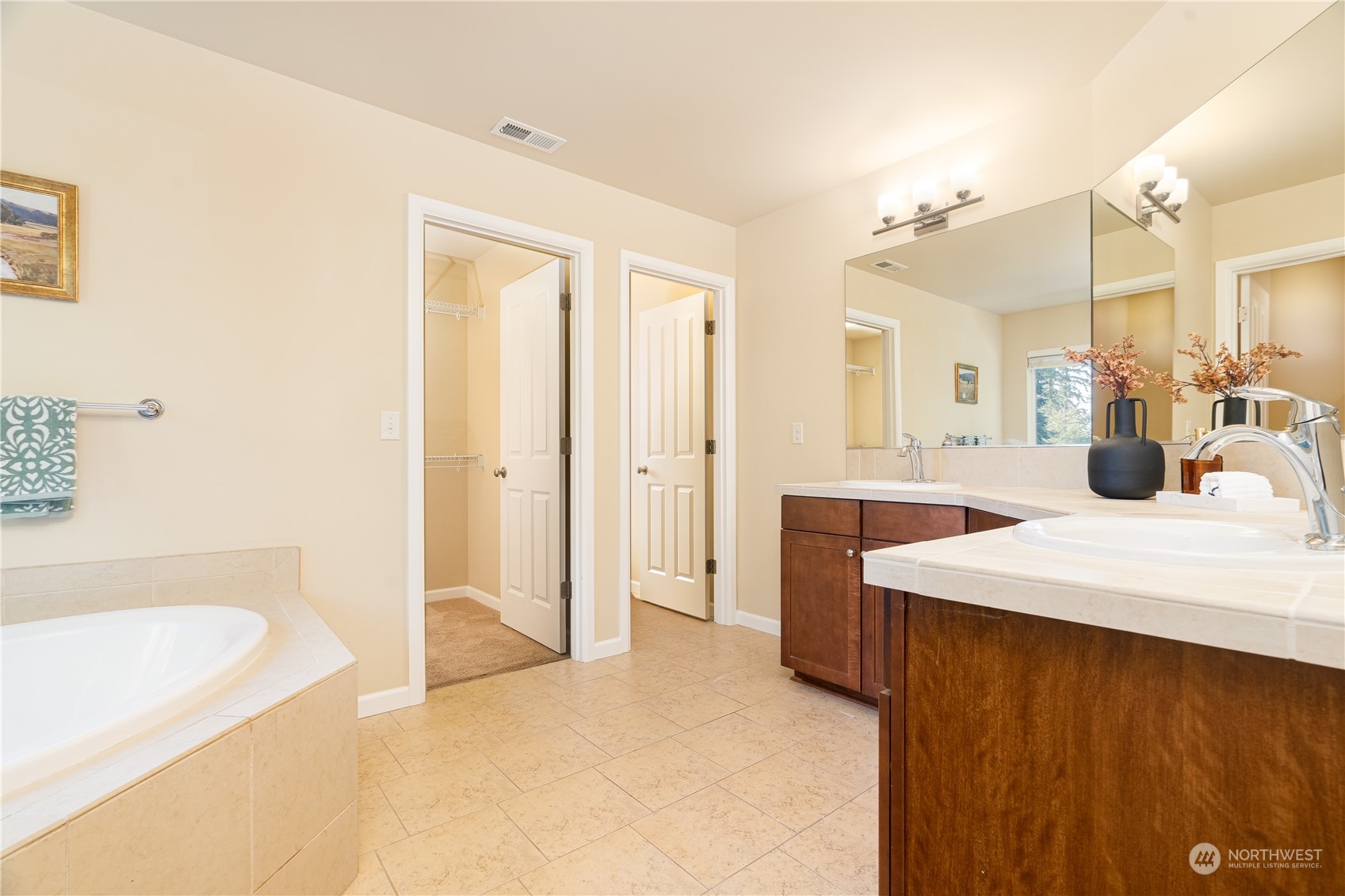 3326 177th Place Southeast Bothell, WA 98012 - Photo 13 of 26 a spacious bathroom with a bathtub sink and mirror