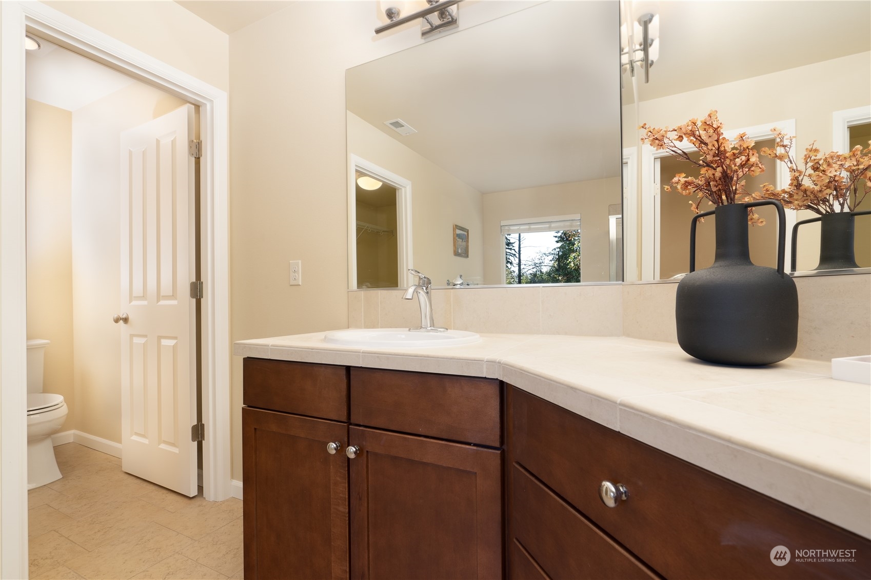 3326 177th Place Southeast Bothell, WA 98012 - Photo 14 of 26 a bathroom with a sink vanity granite and a mirror