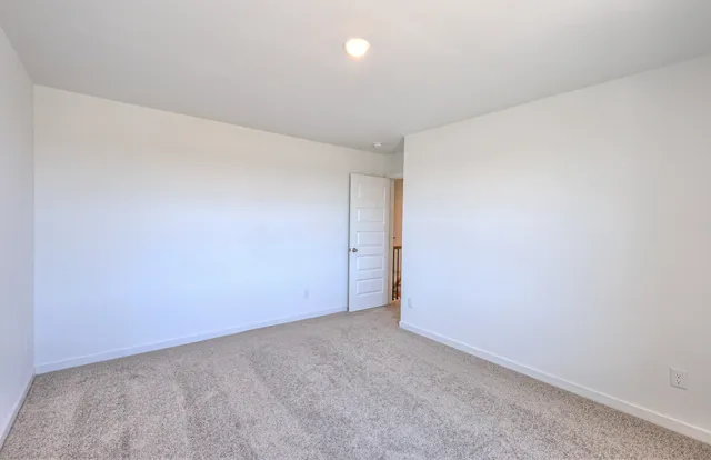 a large kitchen with stainless steel appliances granite countertop a sink a stove and a refrigerator