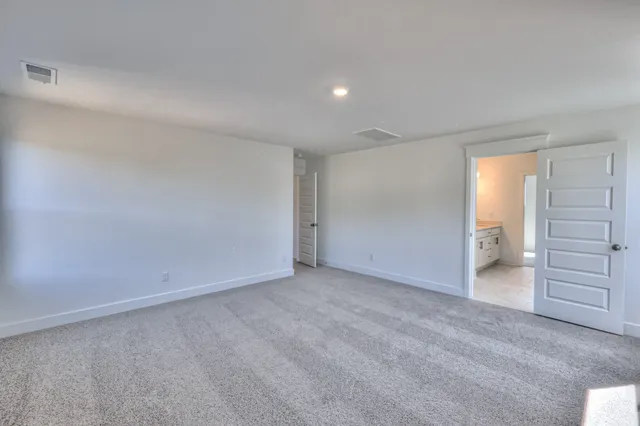 a bathroom with a glass shower door and a bathroom