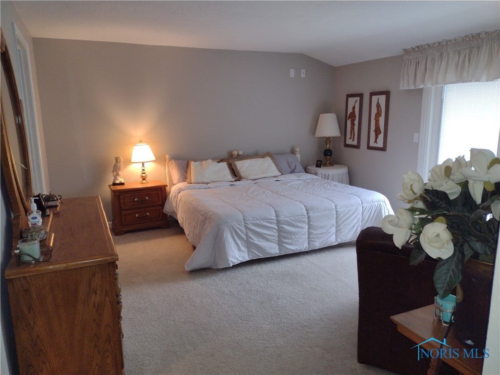 124 Country Club Road Bryan, OH 43506 - Photo 13 of 49 Primary main floor bedroom.