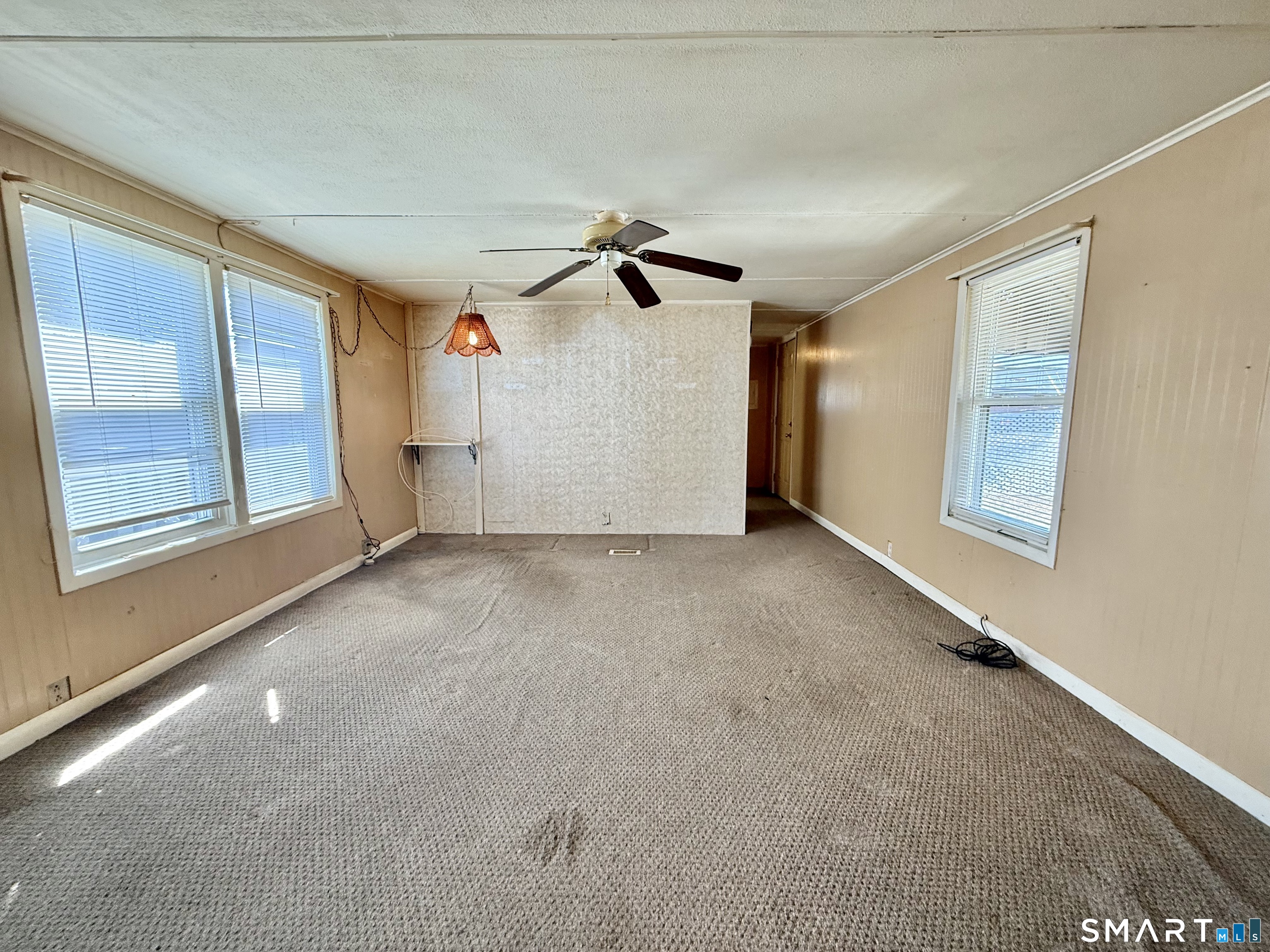 9 N Road East Windsor, CT 06088 - Photo 12 of 20 a view of a livingroom with a ceiling fan and window