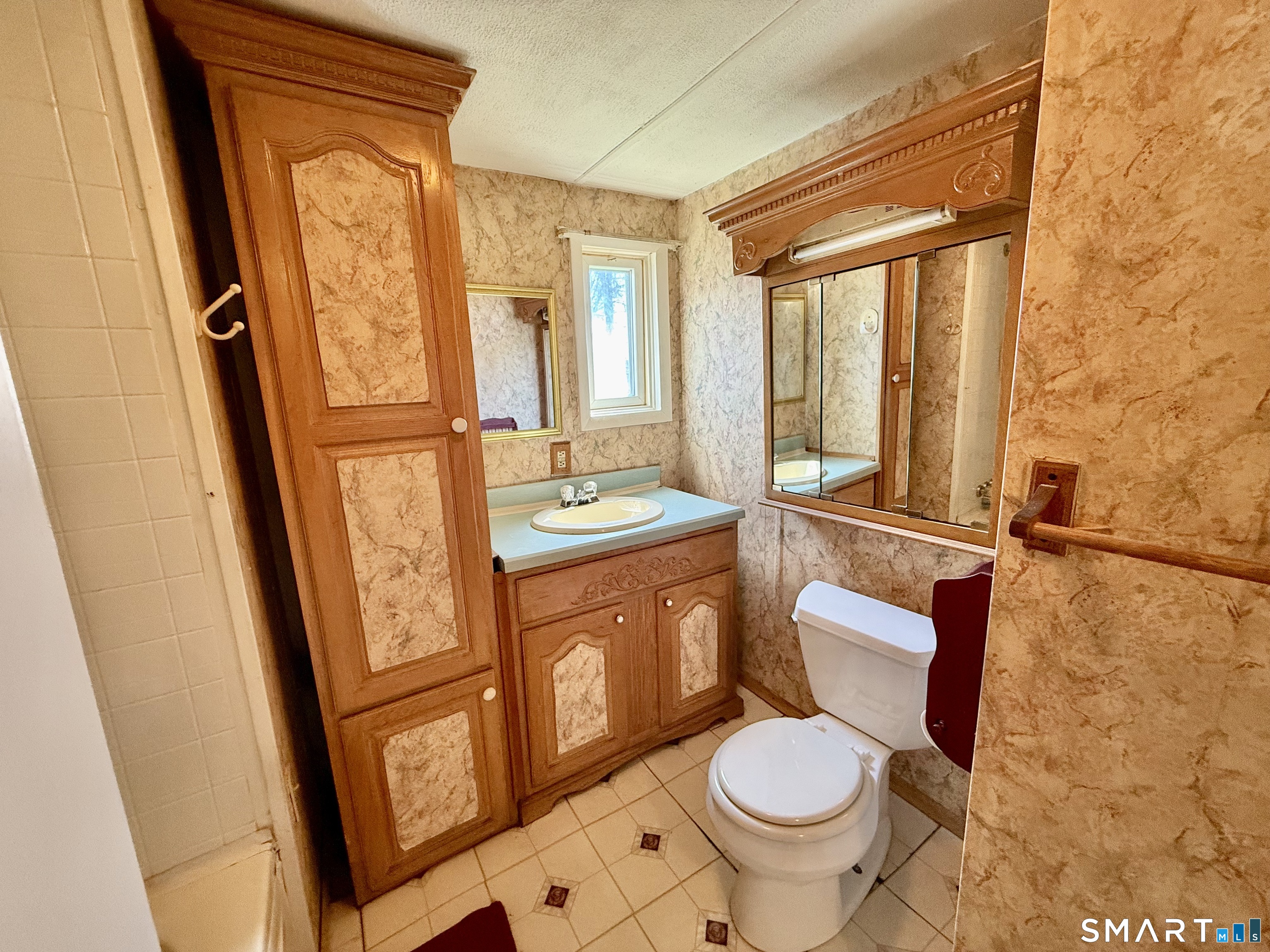 9 N Road East Windsor, CT 06088 - Photo 17 of 20 a bathroom with a granite countertop toilet sink and mirror