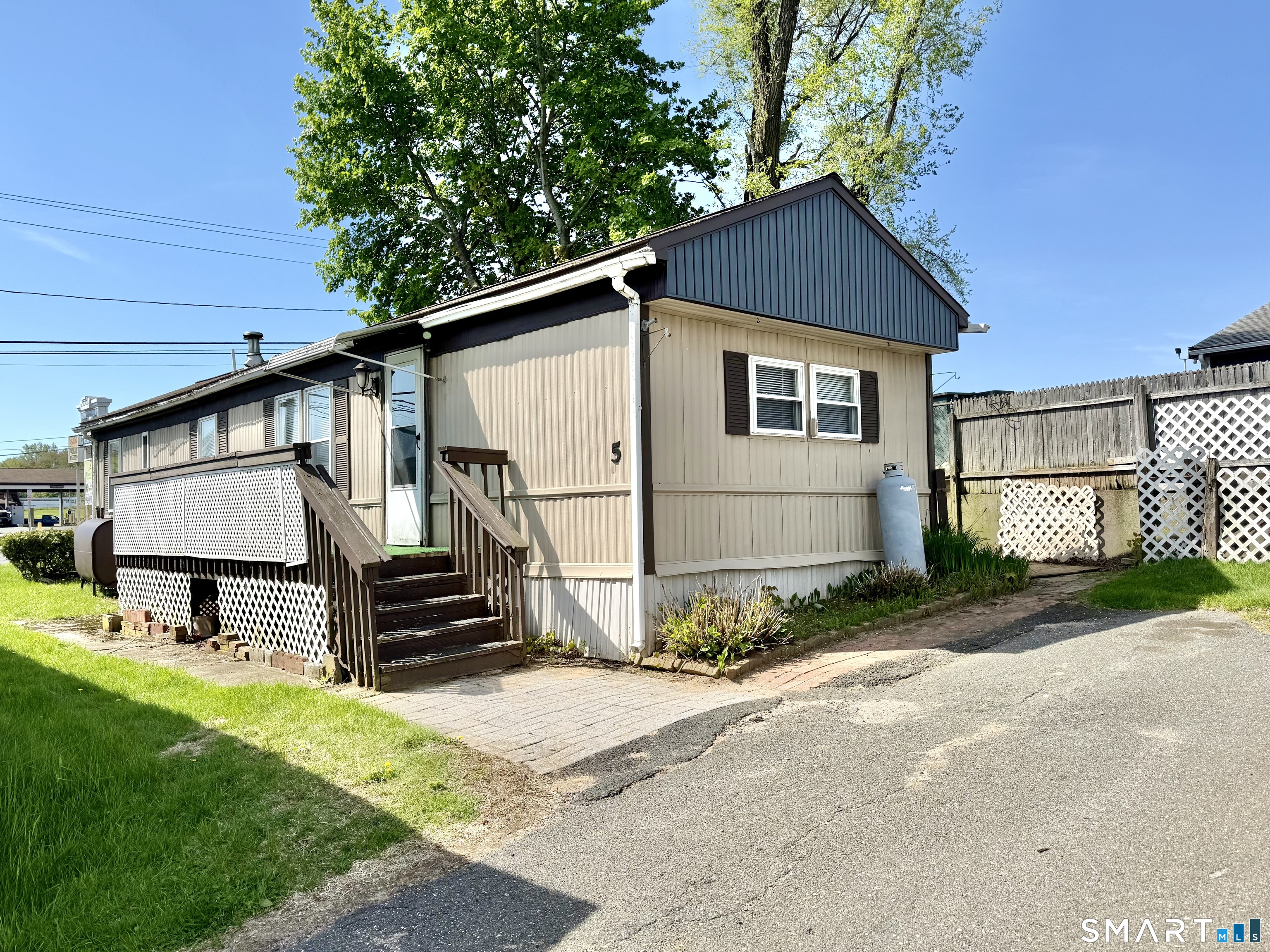 9 N Road East Windsor, CT 06088 - Photo 2 of 20 a house with trees in the background