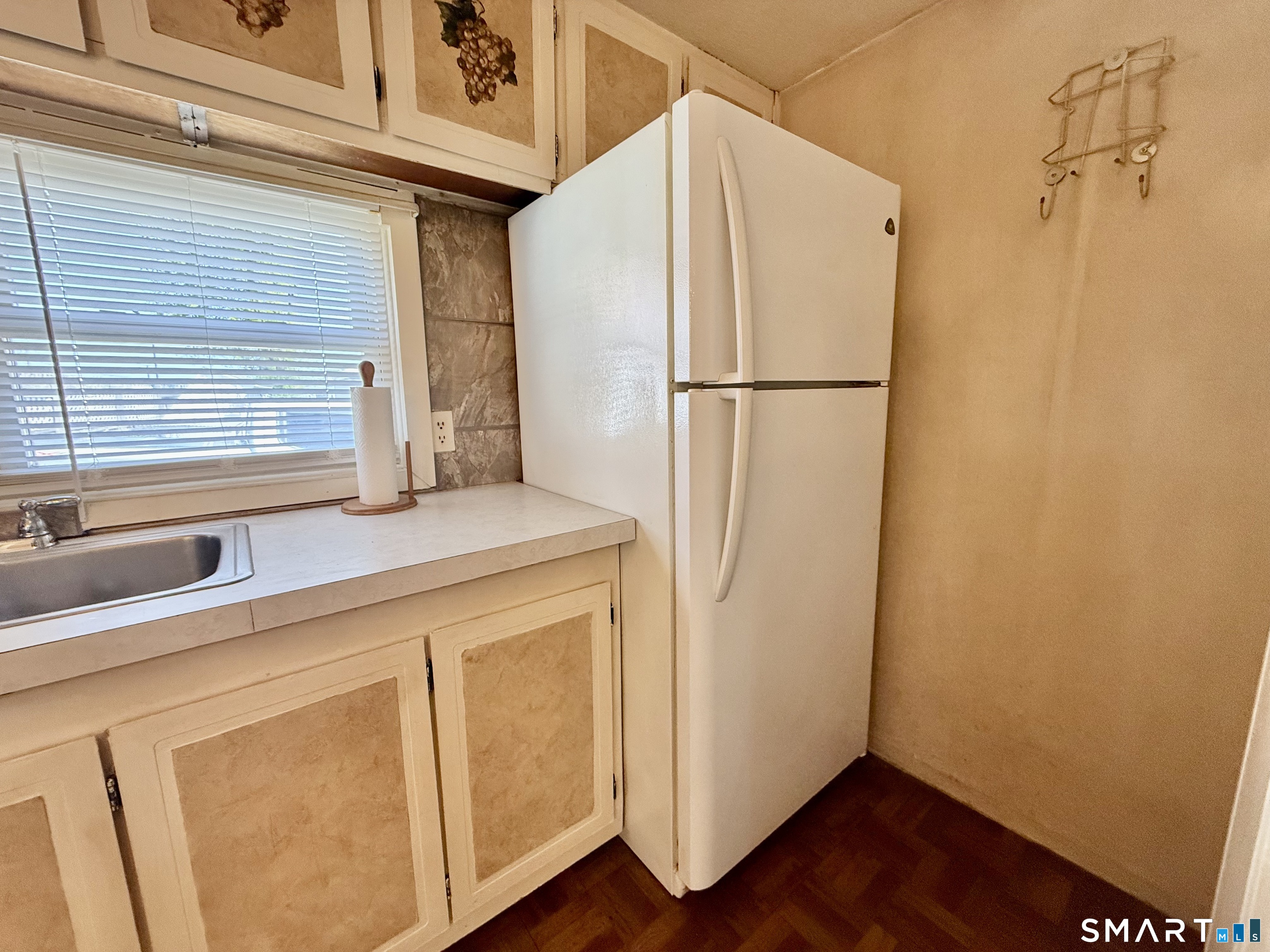 9 N Road East Windsor, CT 06088 - Photo 9 of 20 a utility room with wooden floor and cabinets