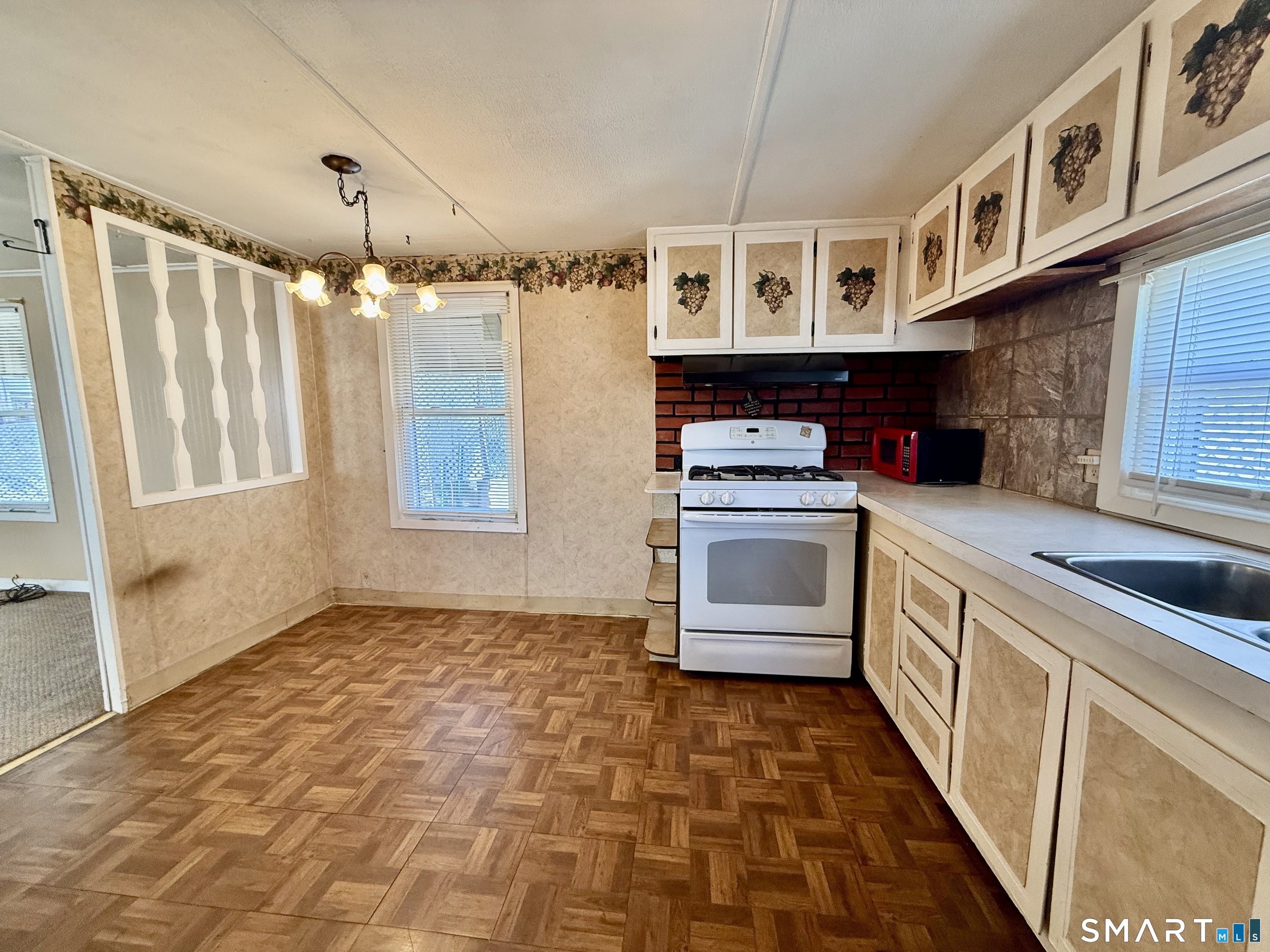 9 N Road East Windsor, CT 06088 - Photo 10 of 20 a kitchen with stainless steel appliances granite countertop a stove and a sink