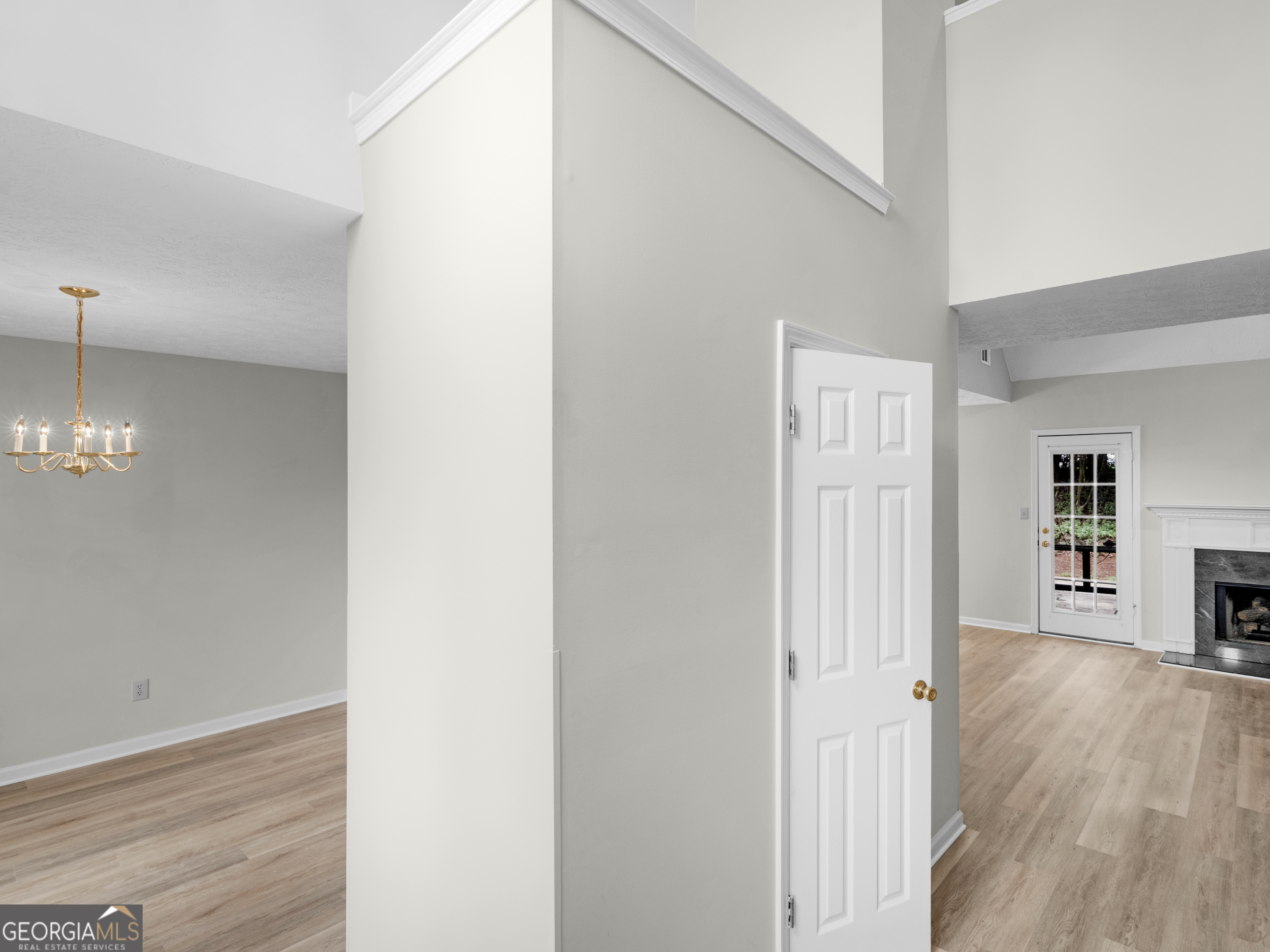 404 Northwind Place Stockbridge, GA 30281 - Photo 13 of 56 a view of a livingroom with wooden floor and a refrigerator