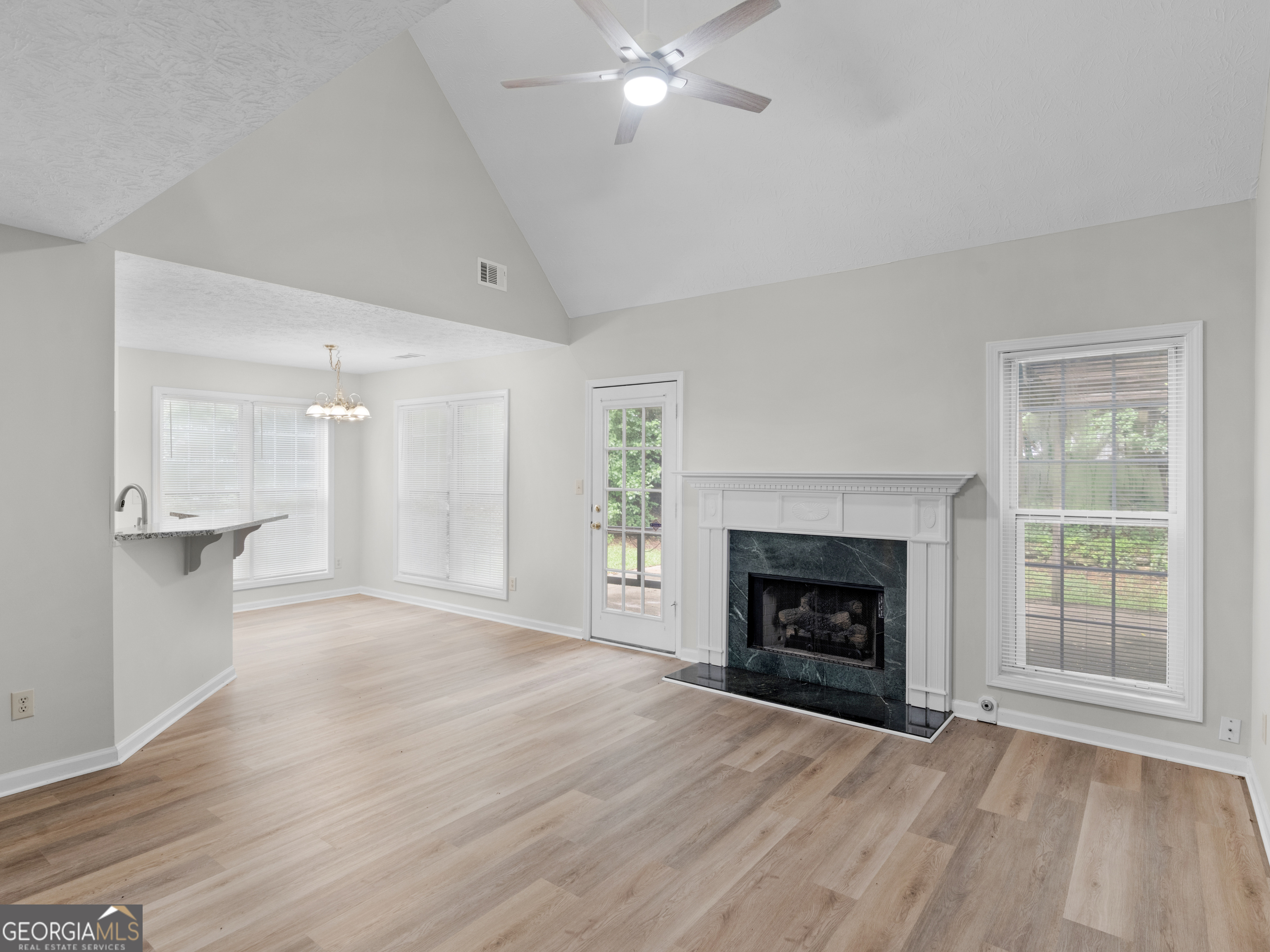 404 Northwind Place Stockbridge, GA 30281 - Photo 16 of 56 a view of an empty room with a fireplace and window