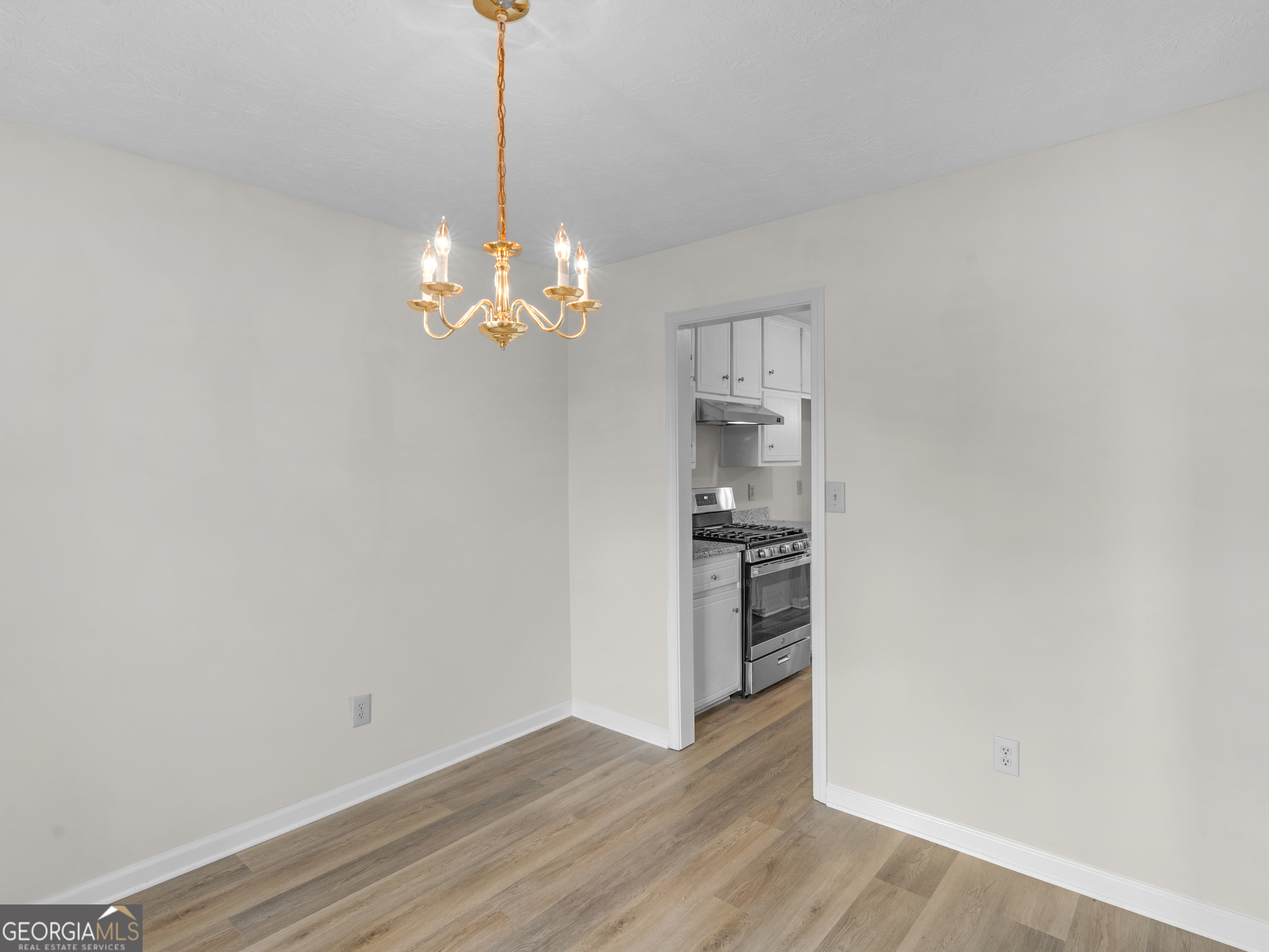 404 Northwind Place Stockbridge, GA 30281 - Photo 18 of 56 a view of a kitchen with wooden floor and a window